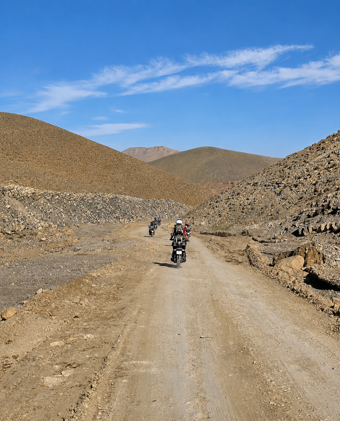 Dusty desert ride through rugged hills